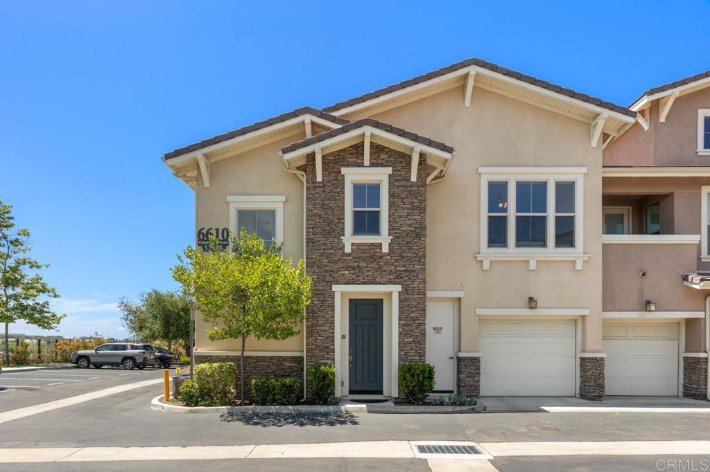 6610 Canopy Ridge Lane, Unit 37 San Diego, CA 92121 - Photo 5 of 65 a front view of a house with a yard