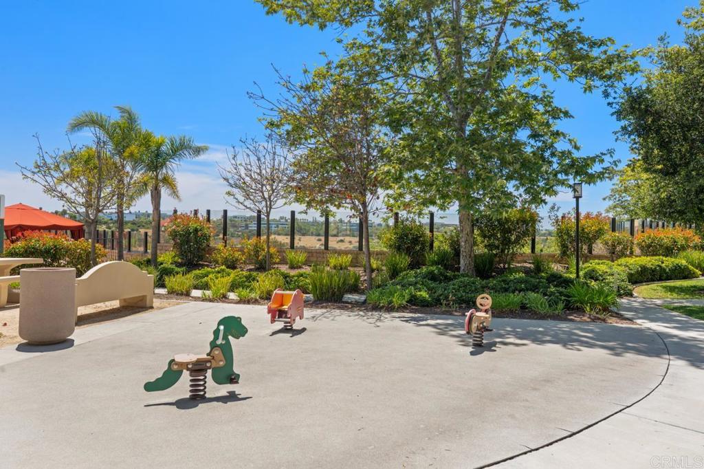 6610 Canopy Ridge Lane, Unit 37 San Diego, CA 92121 - Photo 55 of 65 a view of a park with swings and slides