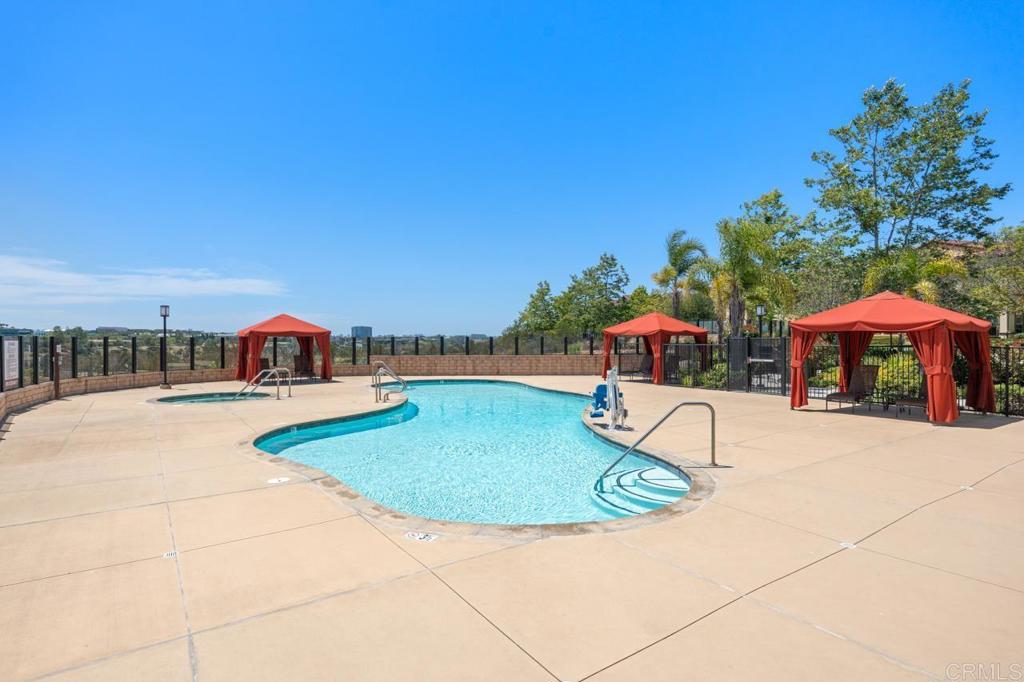 6610 Canopy Ridge Lane, Unit 37 San Diego, CA 92121 - Photo 58 of 65 a swimming pool with outdoor seating