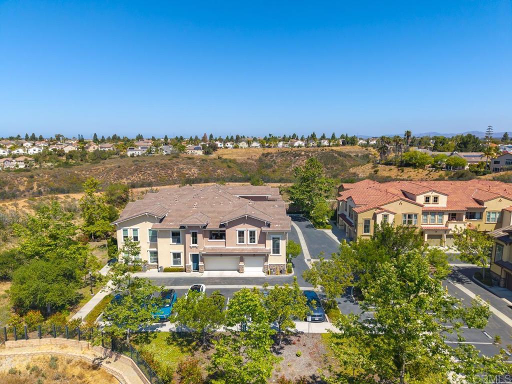 6610 Canopy Ridge Lane, Unit 37 San Diego, CA 92121 - Photo 64 of 65 an aerial view of residential houses with outdoor space and trees