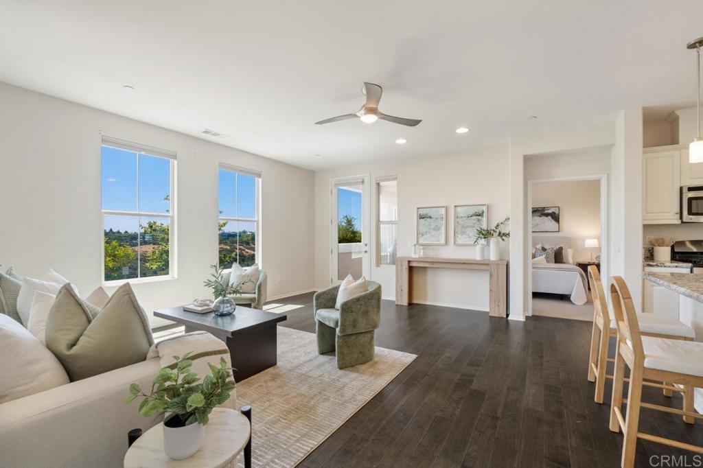 6610 Canopy Ridge Lane, Unit 37 San Diego, CA 92121 - Photo 10 of 65 a living room with fireplace furniture and a wooden floor