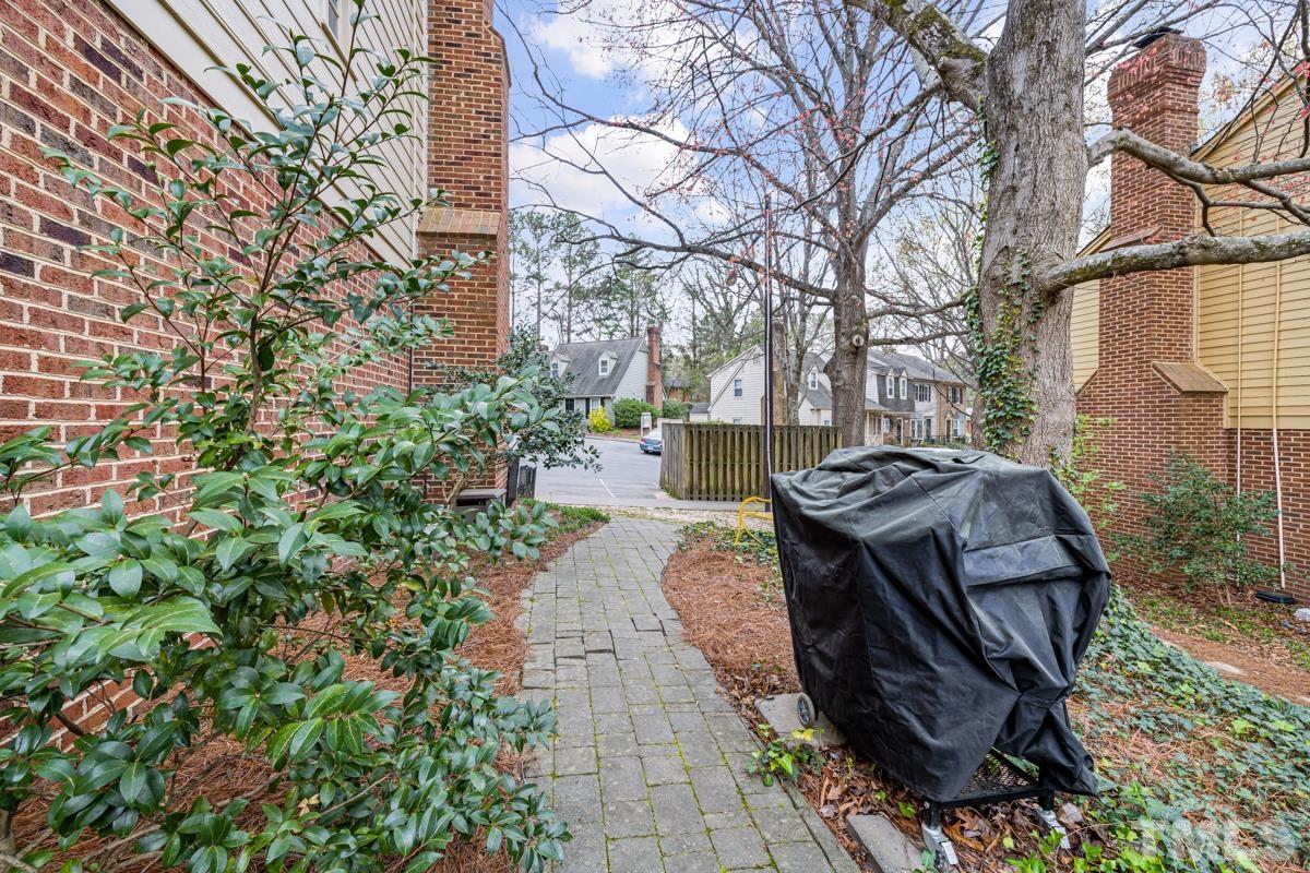1336 Dylan Heath Court Raleigh, NC 27608 - Photo 11 of 25 a view of a garden with sitting area
