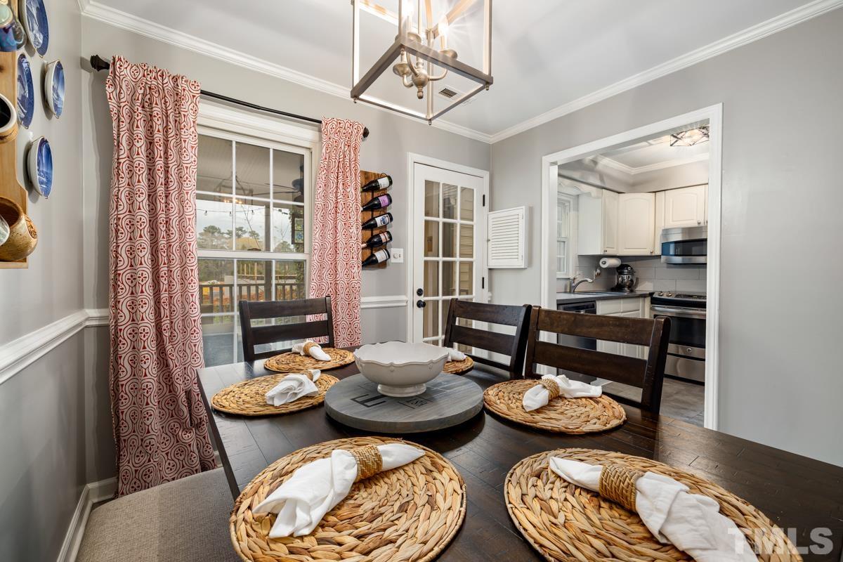 1336 Dylan Heath Court Raleigh, NC 27608 - Photo 12 of 25 a open dining room with furniture