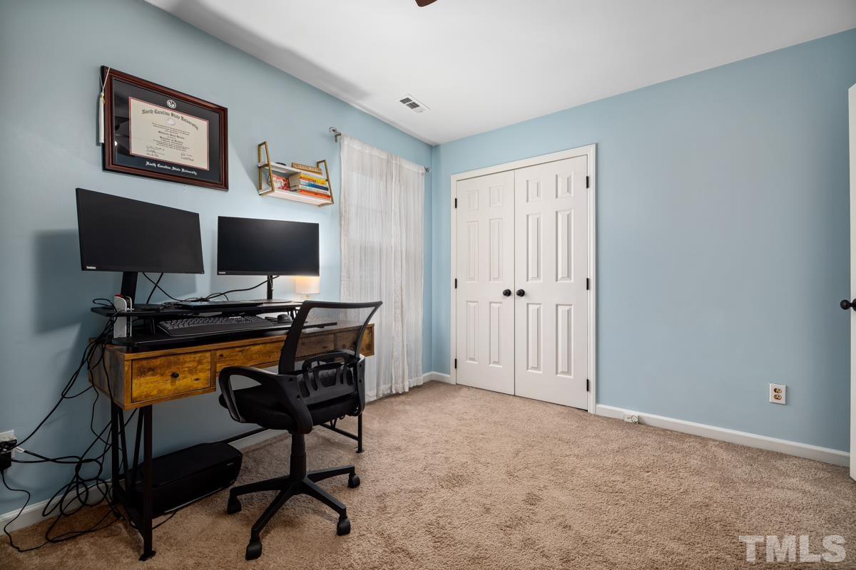 1336 Dylan Heath Court Raleigh, NC 27608 - Photo 22 of 25 a view of a workspace with furniture and a window