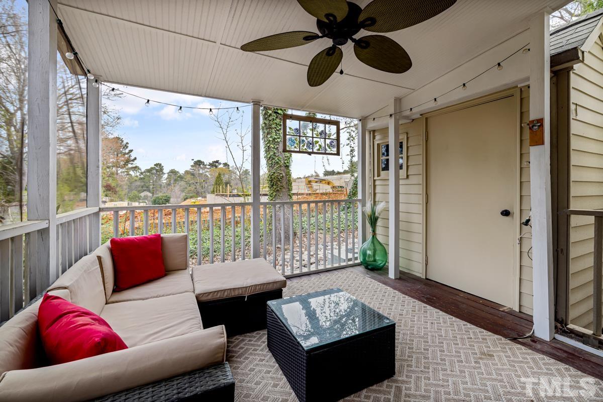 1336 Dylan Heath Court Raleigh, NC 27608 - Photo 10 of 25 a living room with furniture and a large window