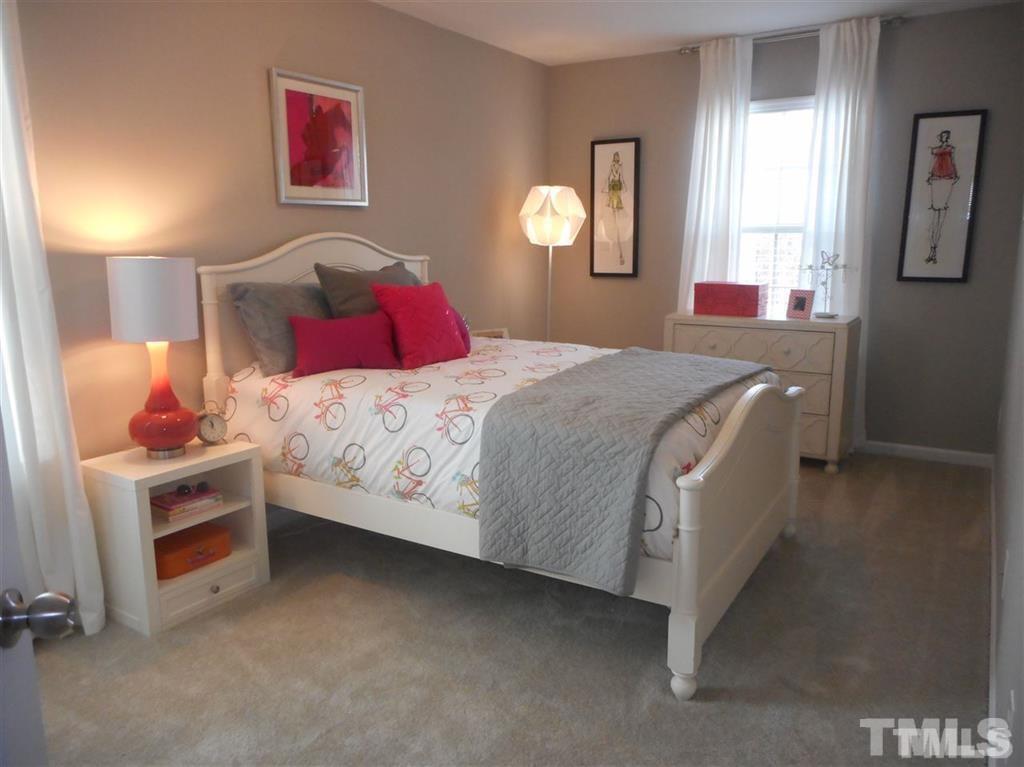 3713 Landshire View Lane Raleigh, NC 27616 - Photo 12 of 15 a bedroom with a bed and a cabinets