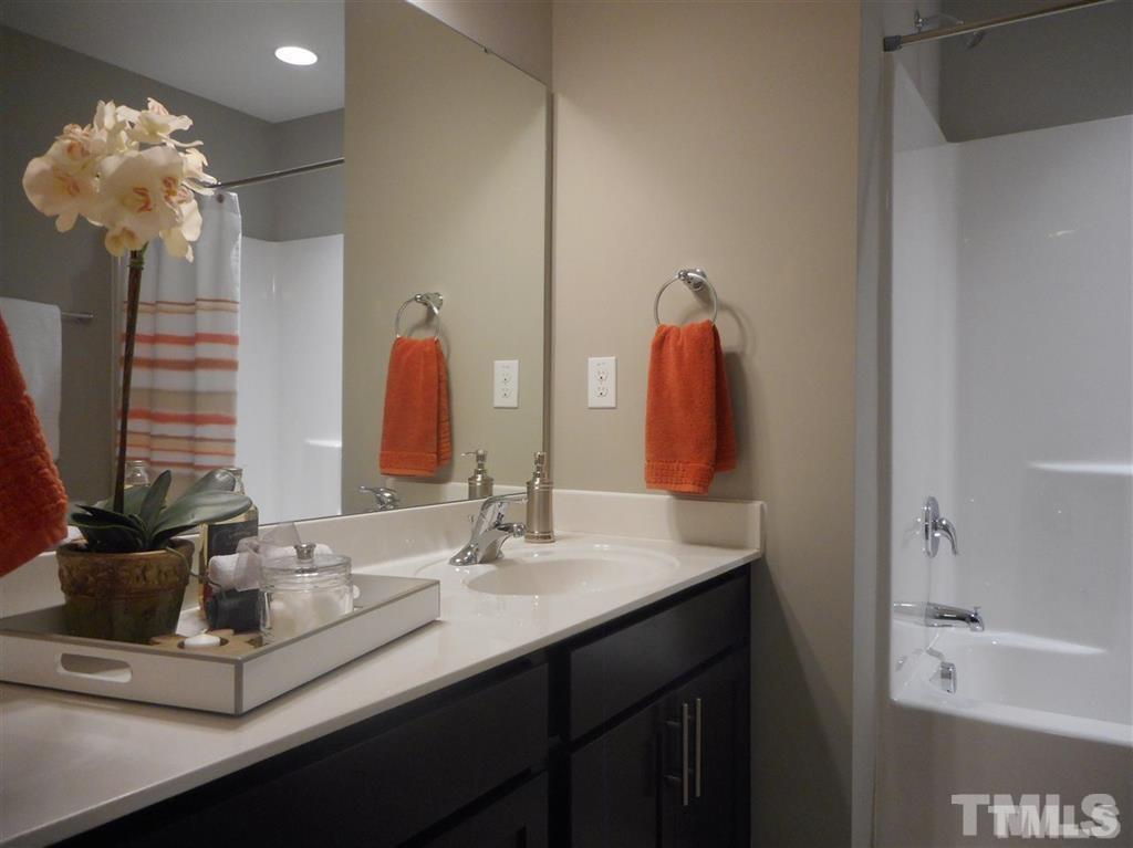 3713 Landshire View Lane Raleigh, NC 27616 - Photo 13 of 15 a bathroom with a sink and a mirror