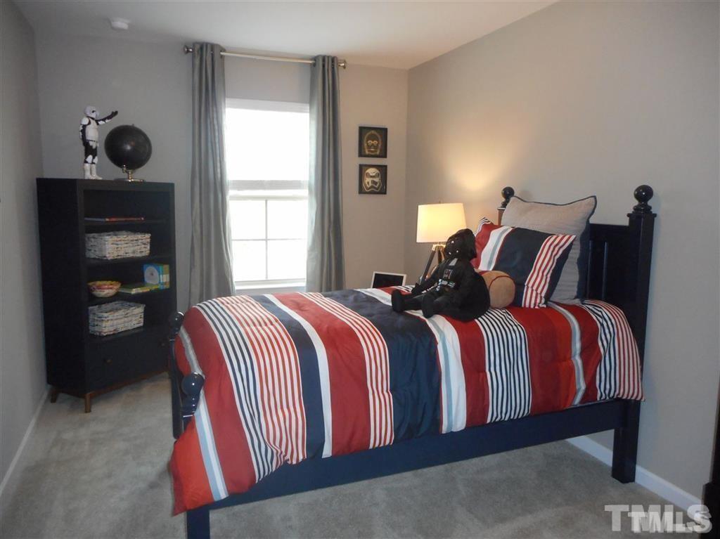 3713 Landshire View Lane Raleigh, NC 27616 - Photo 14 of 15 a bedroom with a bed and window