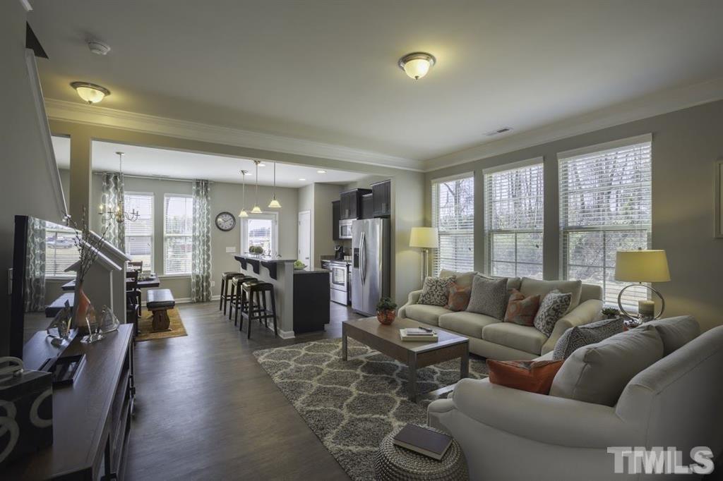 3713 Landshire View Lane Raleigh, NC 27616 - Photo 2 of 15 a living room with furniture and a flat screen tv