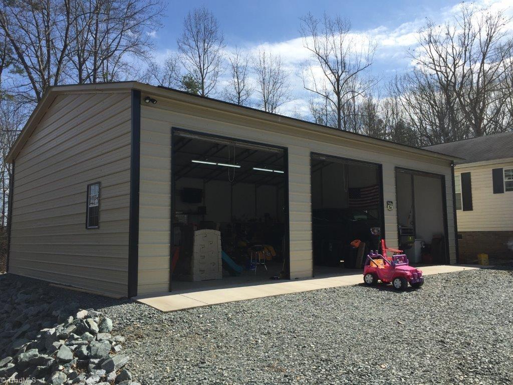810 Jolly Road Lexington, NC 27292 - Photo 3 of 18 Park all your cars in this great garage, even your precious Pink all terrain vehicle!