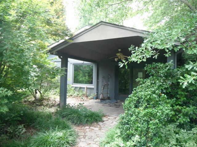 1999 Thomas Road Cleveland, GA 30528 - Photo 1 of 1 a front view of a house with garden