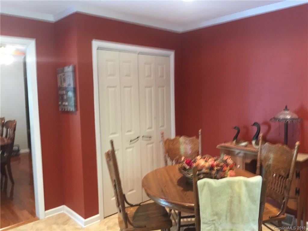 5825 Cress Road Concord, NC 28025 - Photo 8 of 23 a view of a dining room with furniture and wooden floor