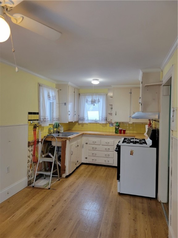 186 Custer Street Warwick, RI 02889 - Photo 5 of 46 Kitchen (view is plumbing where a washer was removed)