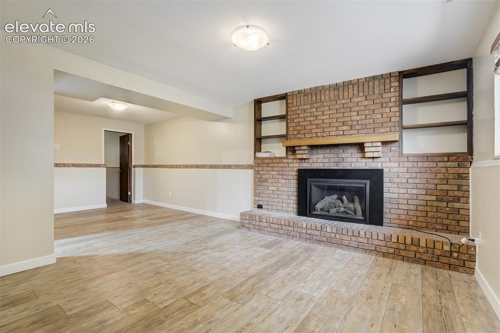 2814 Ridgeglen Place Colorado Springs, CO 80918 - Photo 23 of 50 Original Brick Fireplace wall with Gas fireplace insert