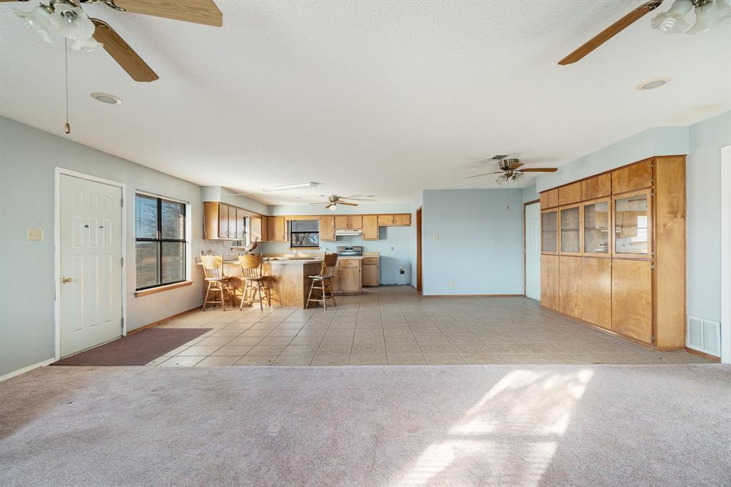 109 Private Road Brookston, TX 75421 - Photo 17 of 26 a view of a livingroom with furniture and a ceiling fan