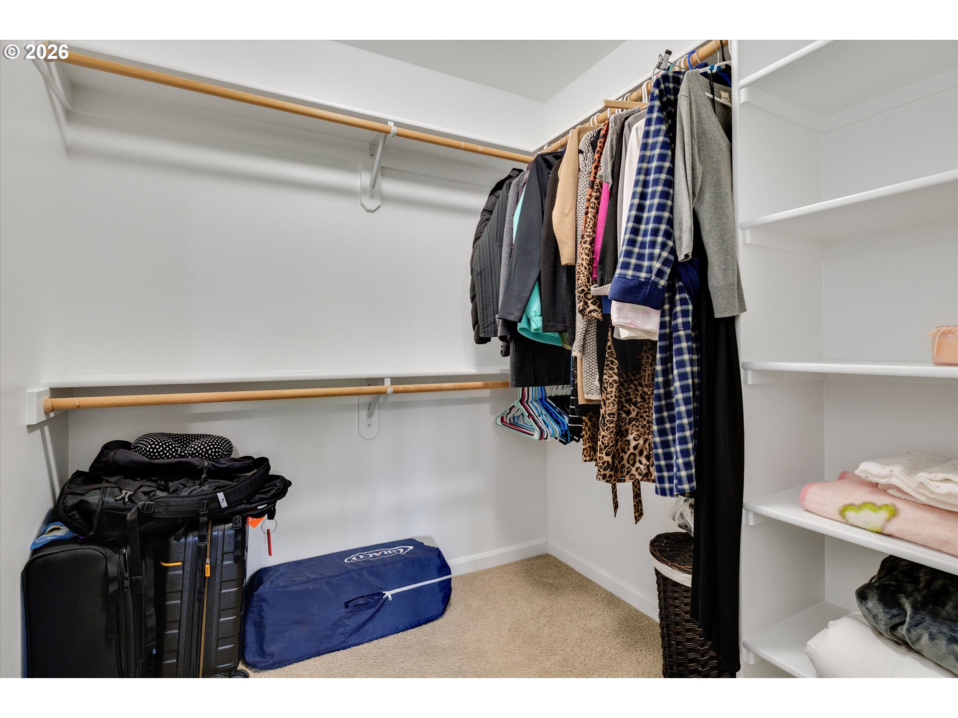 3769 10th Street Hubbard, OR 97032 - Photo 30 of 47 a view of walk in closet with clothes and shoes