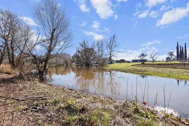 a view of a lake with a big yard