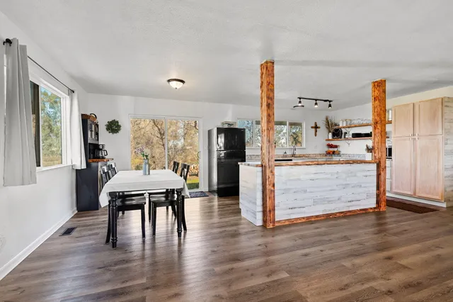 a view of a dining room with furniture window and wooden floor