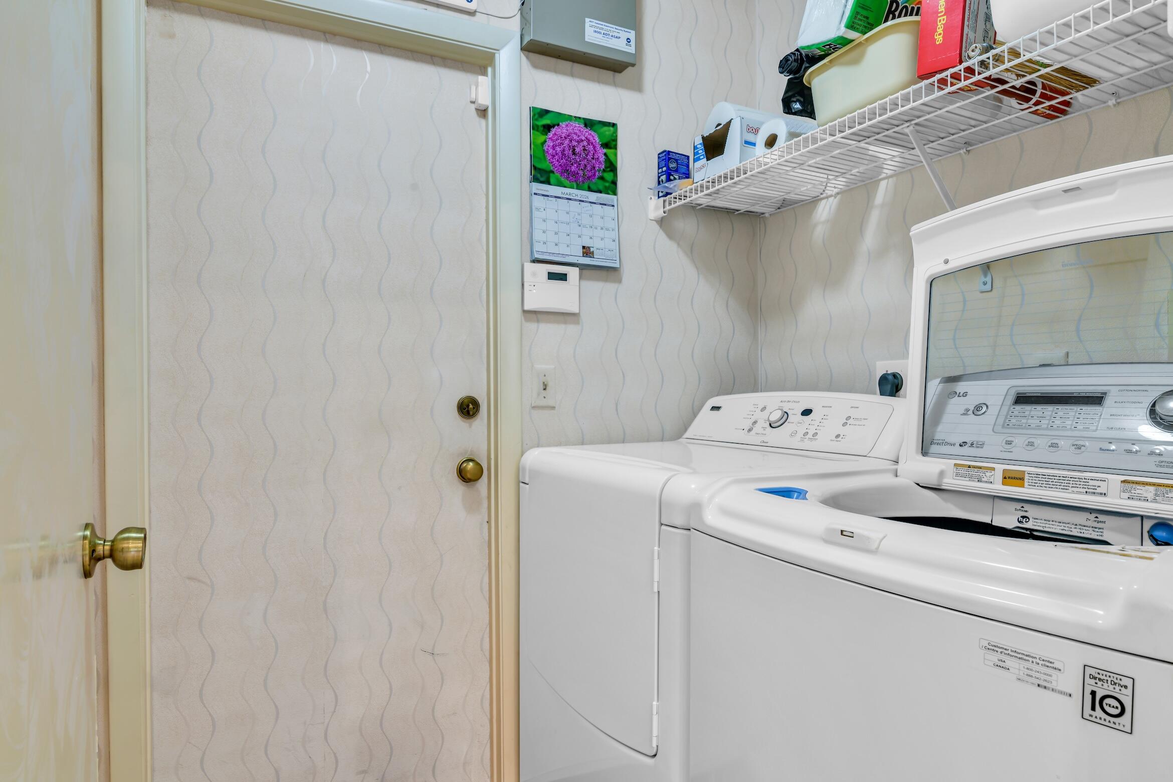 2660 Riviera Drive Delray Beach, FL 33445 - Photo 12 of 40 a utility room with dryer and washer