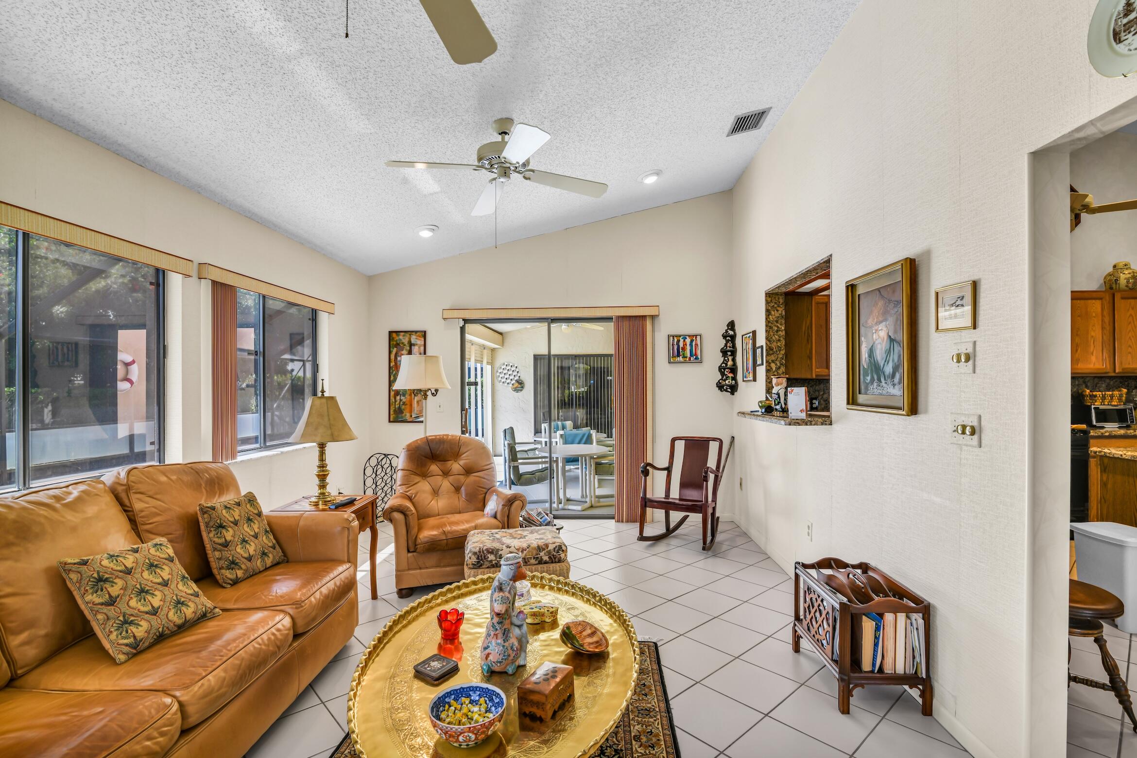 2660 Riviera Drive Delray Beach, FL 33445 - Photo 13 of 40 a living room with furniture and large windows