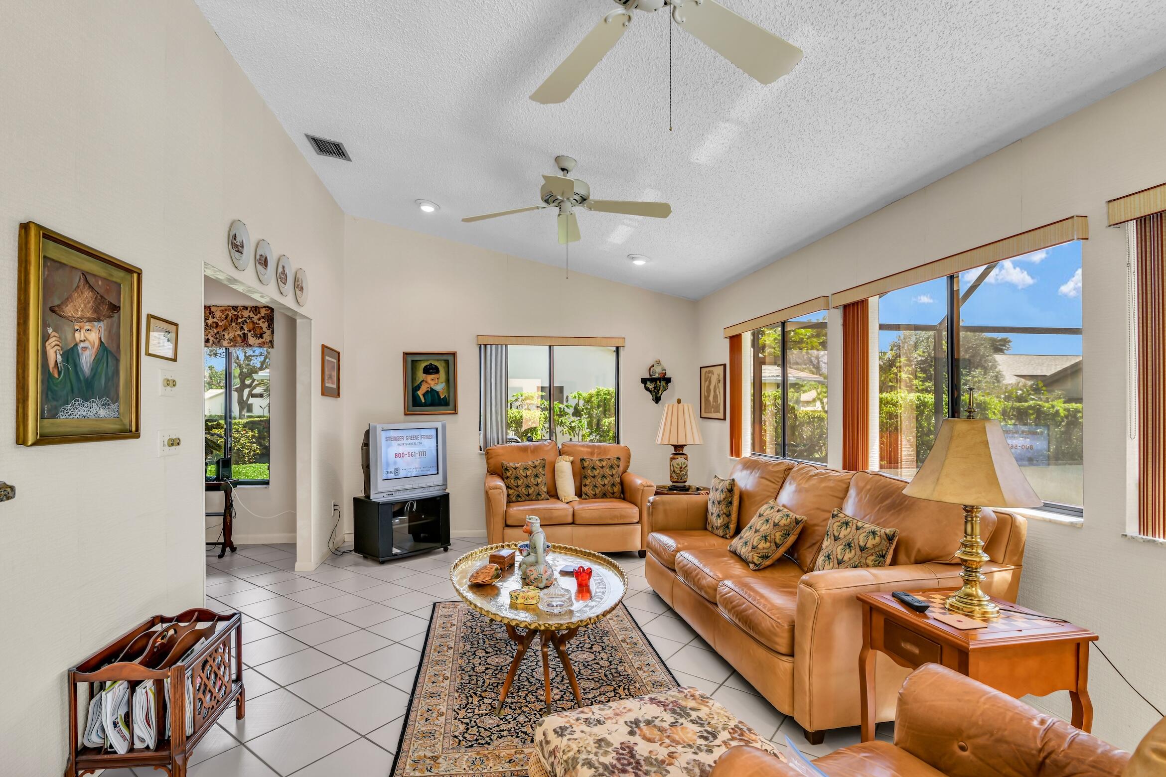 2660 Riviera Drive Delray Beach, FL 33445 - Photo 20 of 40 a living room with furniture ceiling fan and a large window