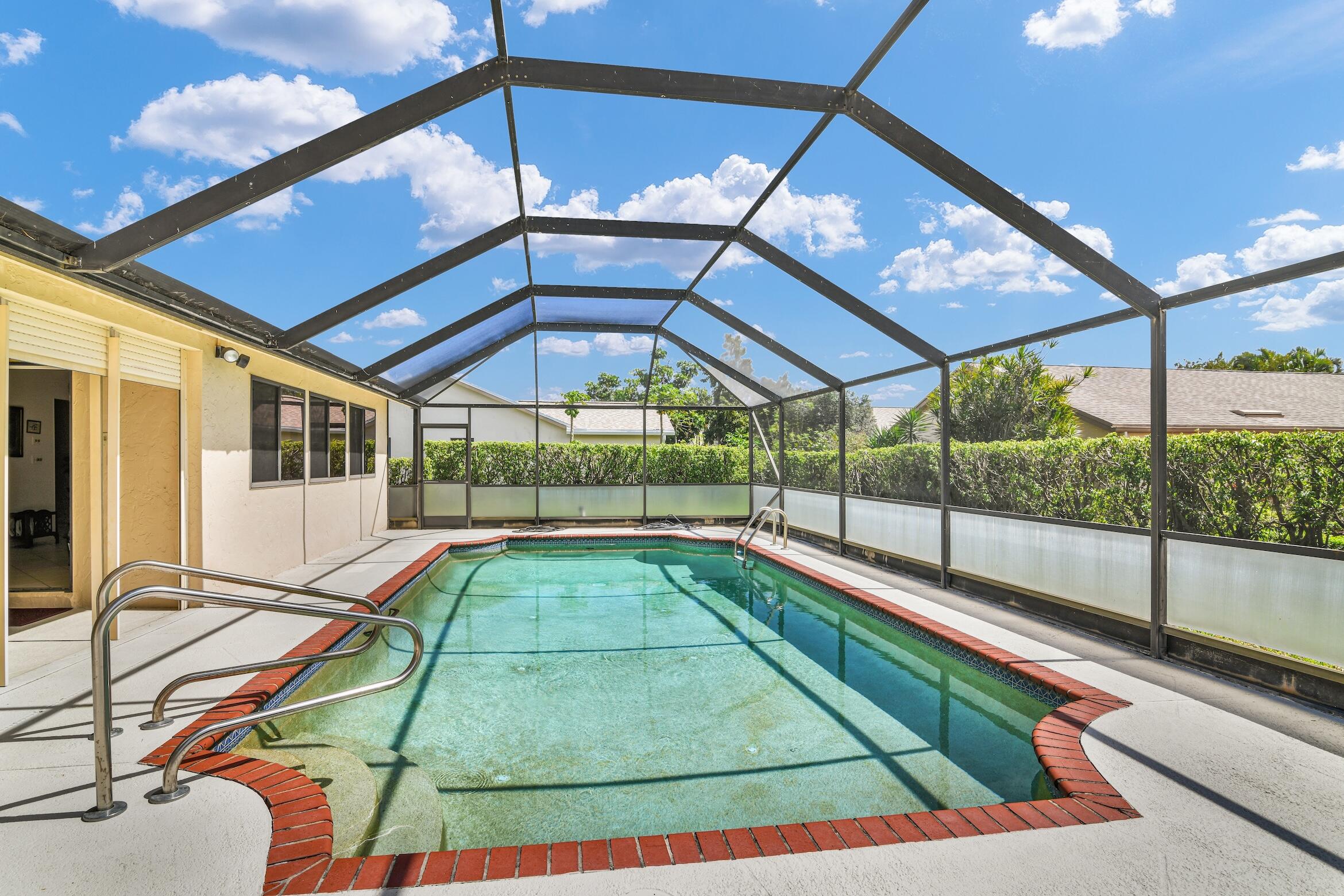 2660 Riviera Drive Delray Beach, FL 33445 - Photo 23 of 40 a view of a backyard with a swimming pool