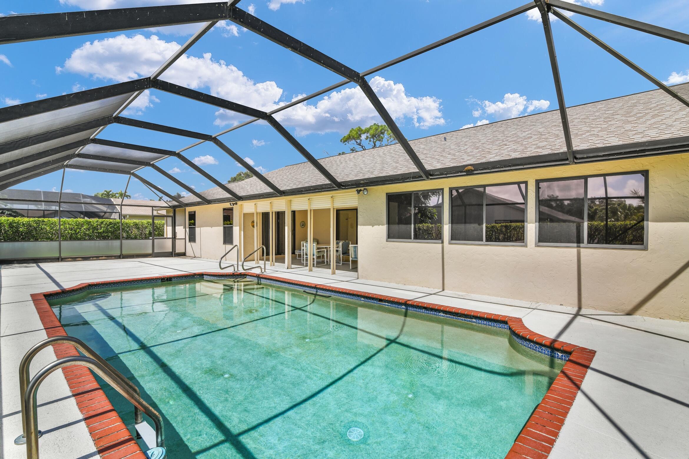 2660 Riviera Drive Delray Beach, FL 33445 - Photo 25 of 40 a view of a backyard with a swimming pool
