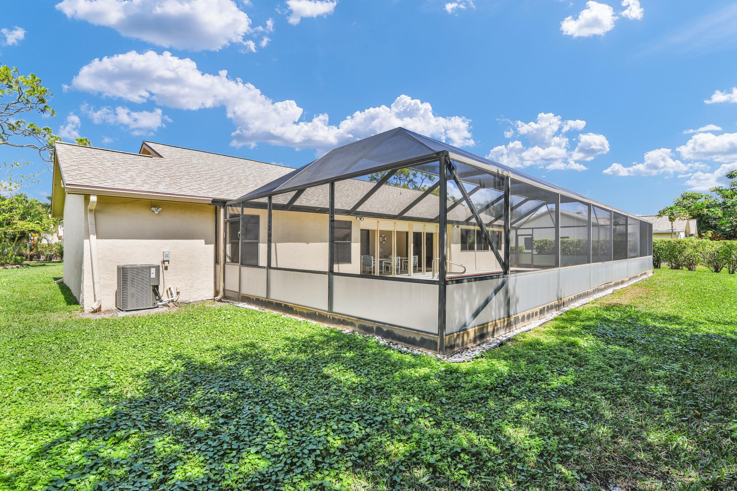 2660 Riviera Drive Delray Beach, FL 33445 - Photo 28 of 40 front view of a house with a yard
