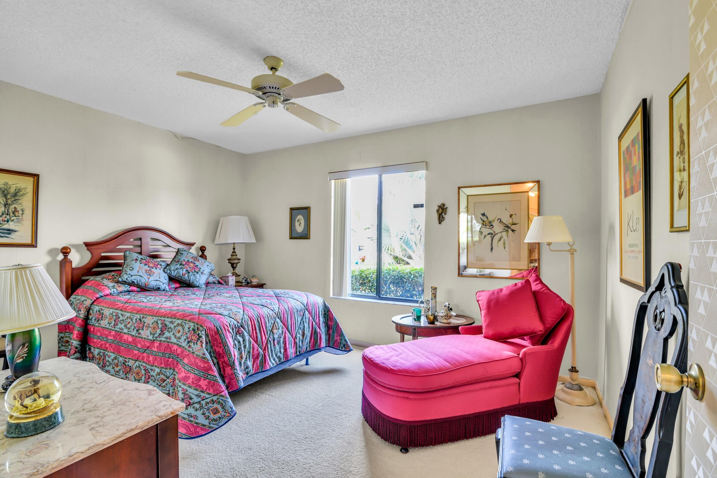 2660 Riviera Drive Delray Beach, FL 33445 - Photo 30 of 40 a bedroom with a bed and furniture