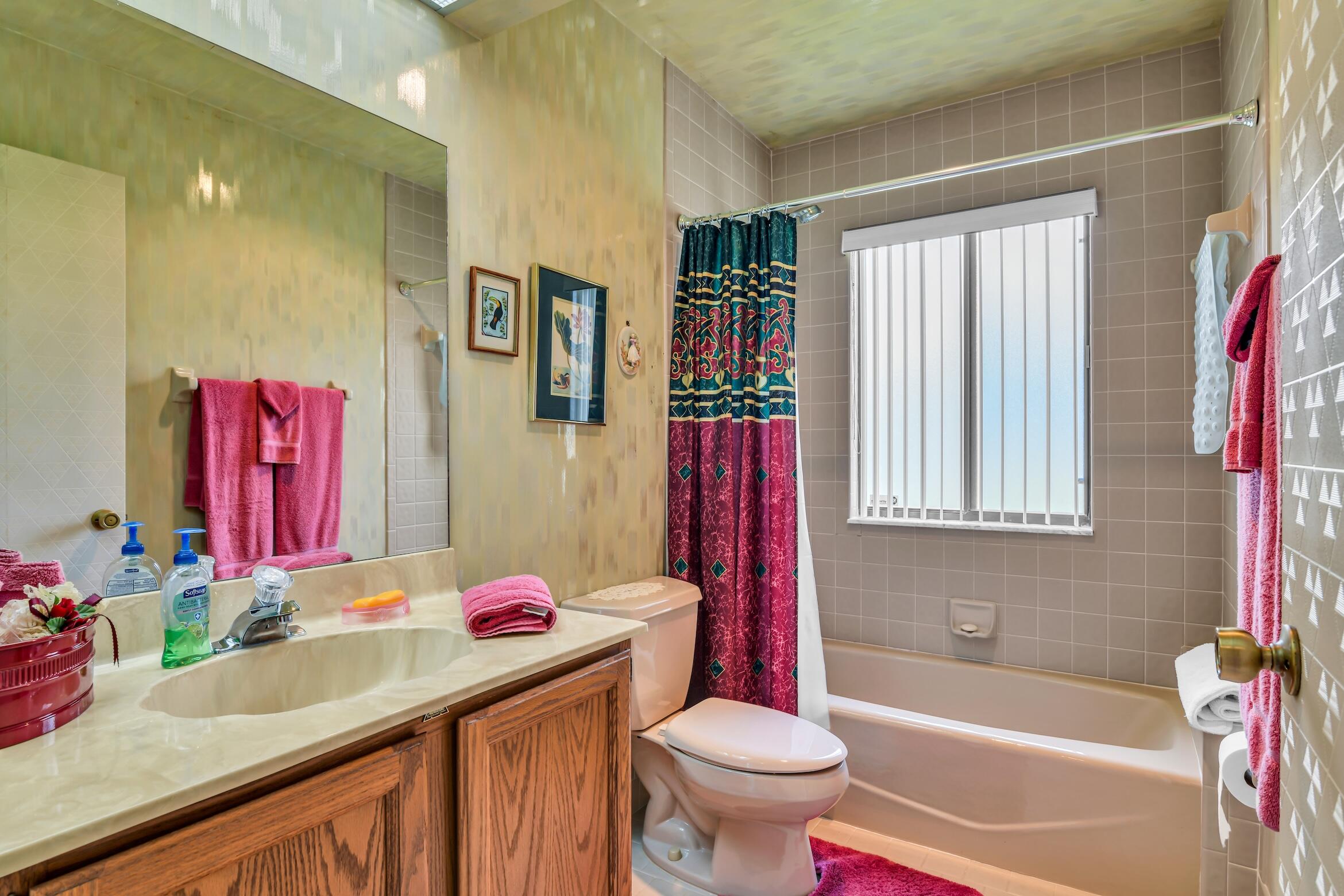 2660 Riviera Drive Delray Beach, FL 33445 - Photo 32 of 40 a bathroom with a sink toilet vanity and tub