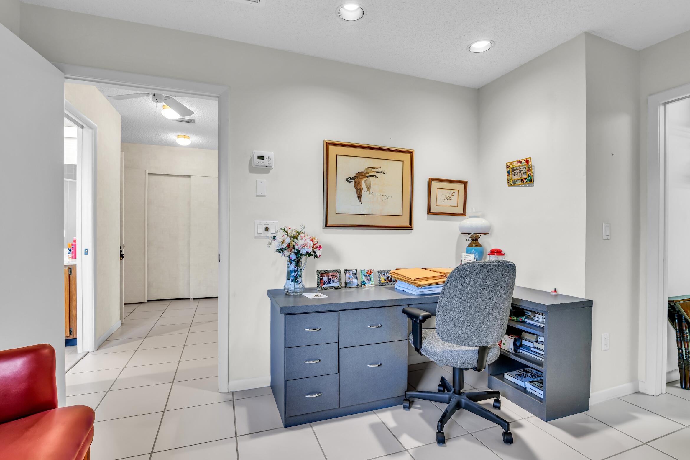 2660 Riviera Drive Delray Beach, FL 33445 - Photo 35 of 40 a view of a workspace with furniture and bathroom