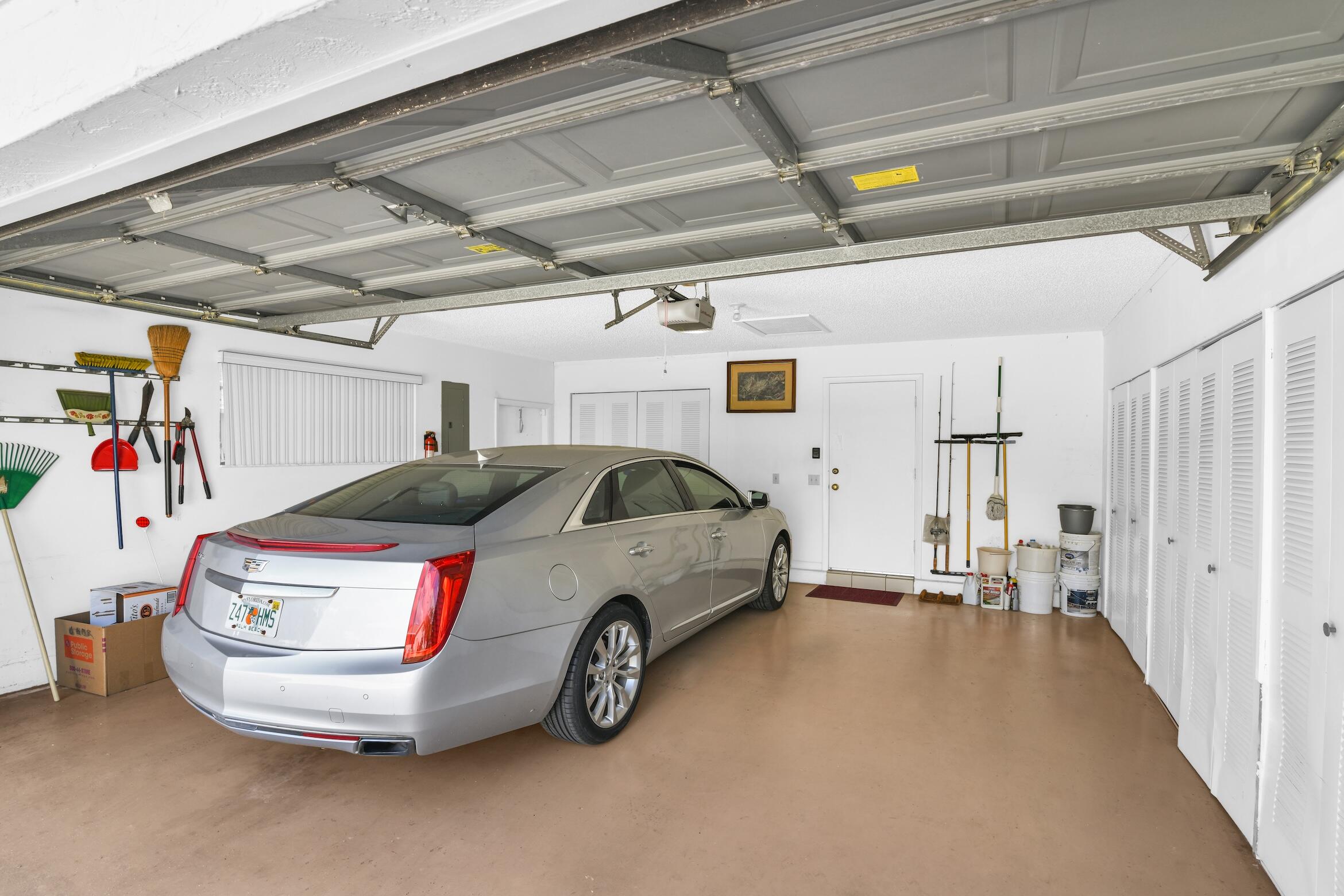 2660 Riviera Drive Delray Beach, FL 33445 - Photo 4 of 40 a car parked in a garage