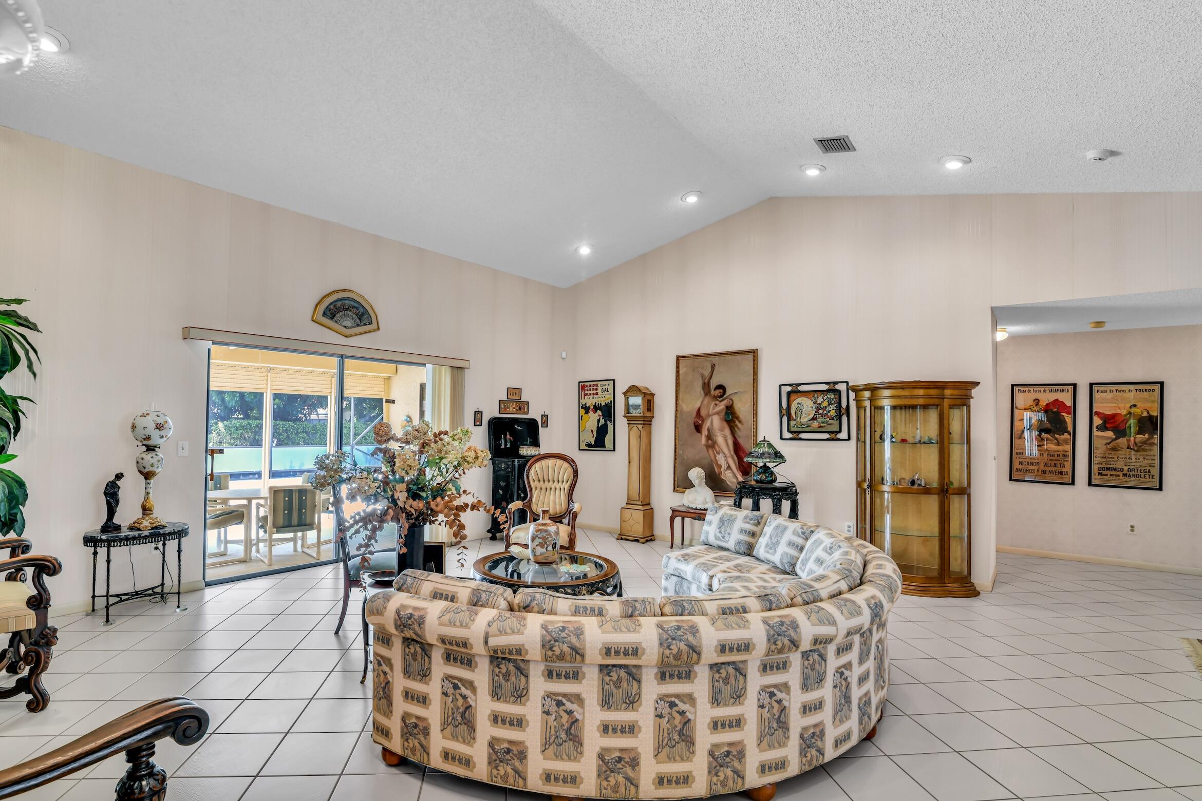 2660 Riviera Drive Delray Beach, FL 33445 - Photo 7 of 40 a living room with furniture and large windows