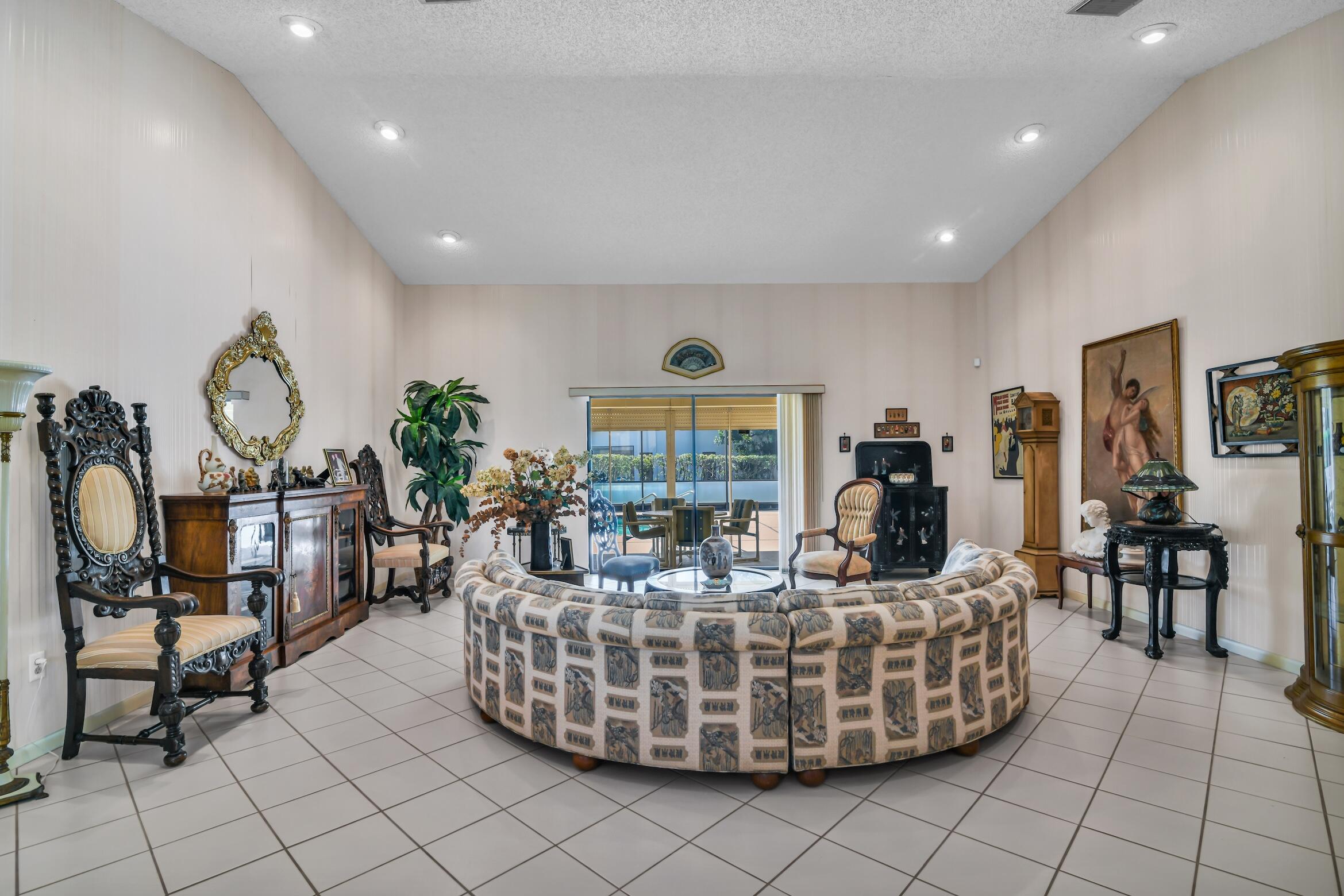 2660 Riviera Drive Delray Beach, FL 33445 - Photo 8 of 40 a living room with furniture and a large window