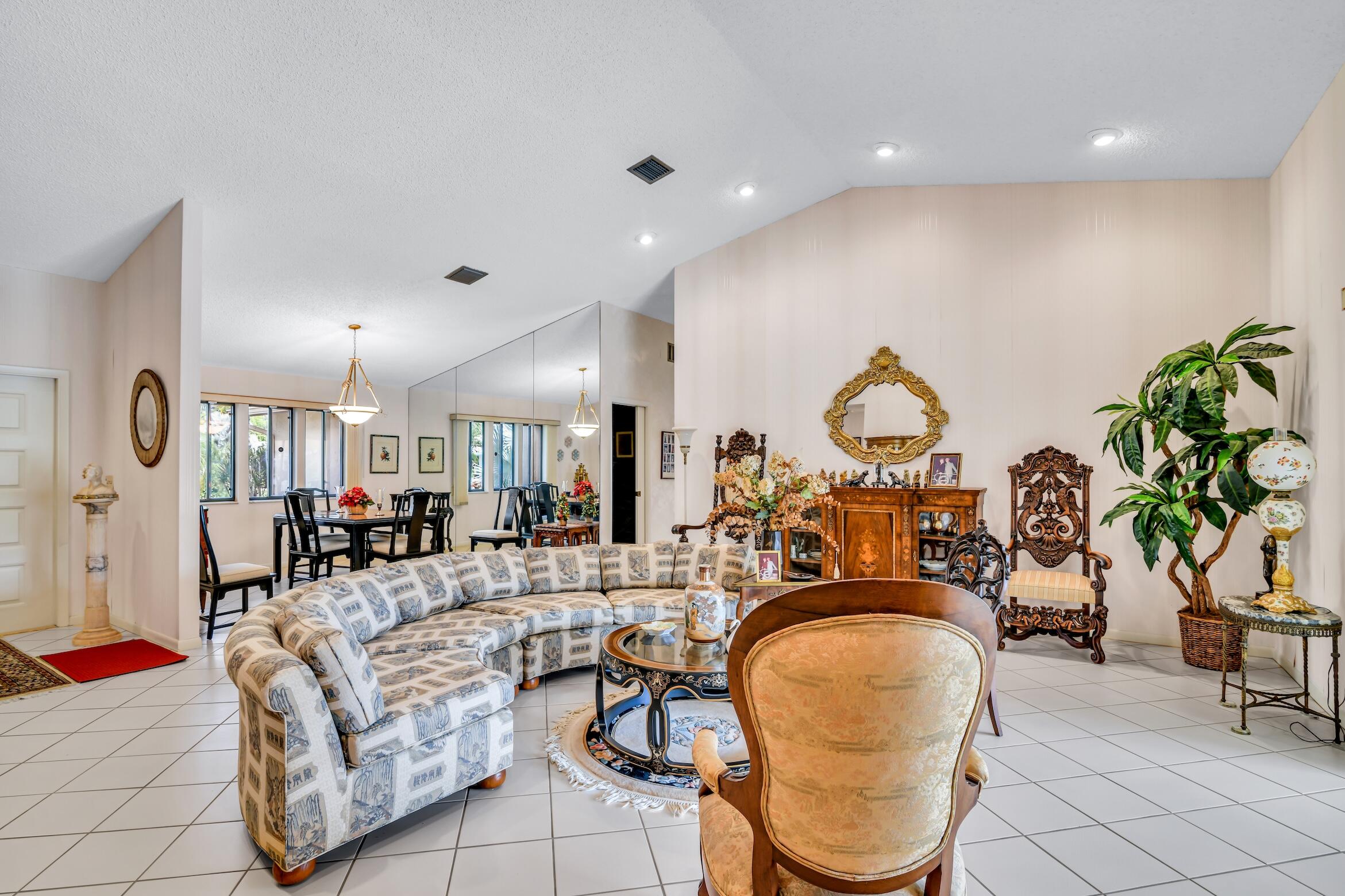 2660 Riviera Drive Delray Beach, FL 33445 - Photo 9 of 40 a living room with fireplace furniture and a potted plant