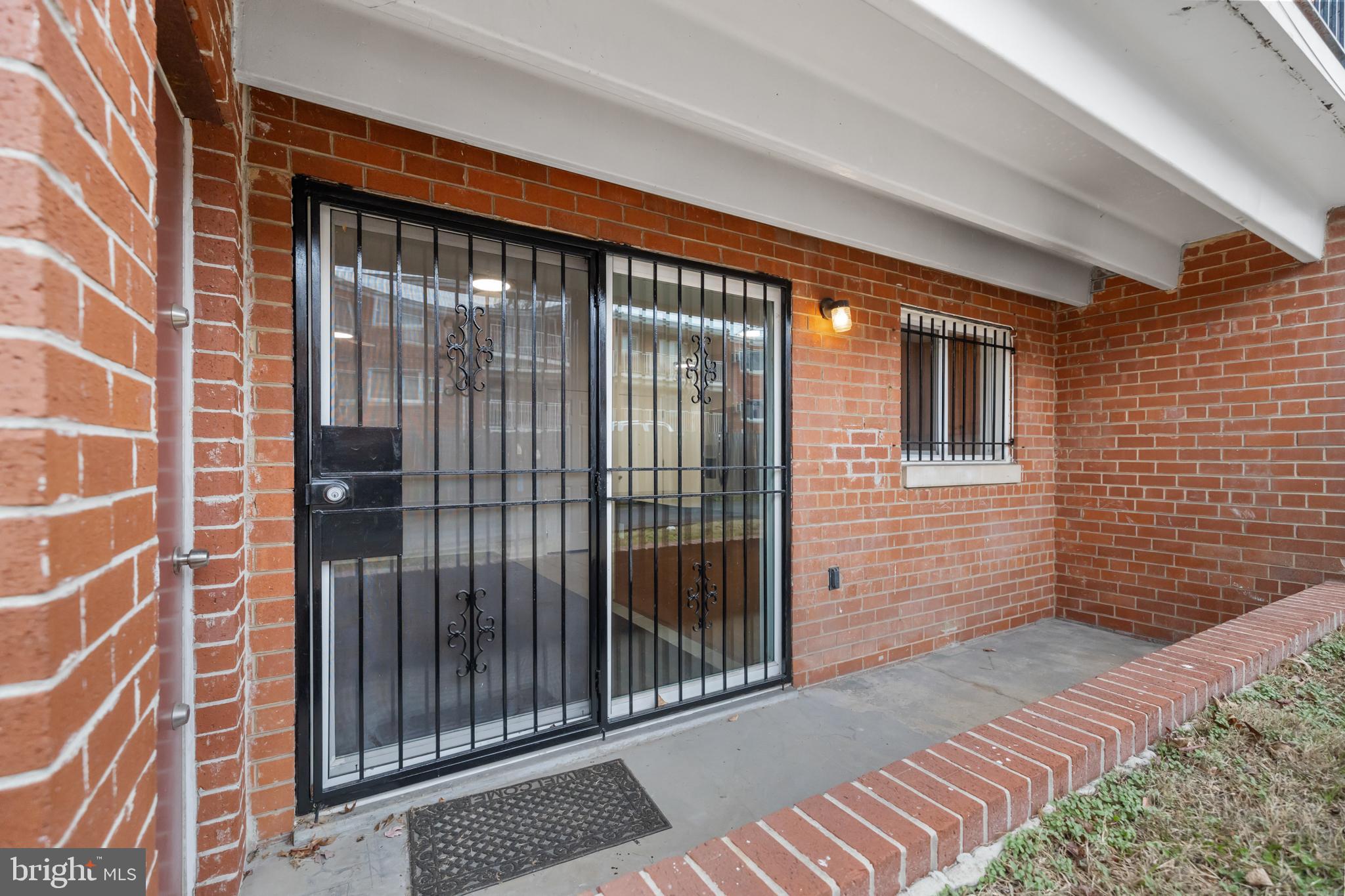 1386 Bryant Street Northeast, Unit 103 Washington, DC 20018 - Photo 24 of 28 a view of a brick house with a large window