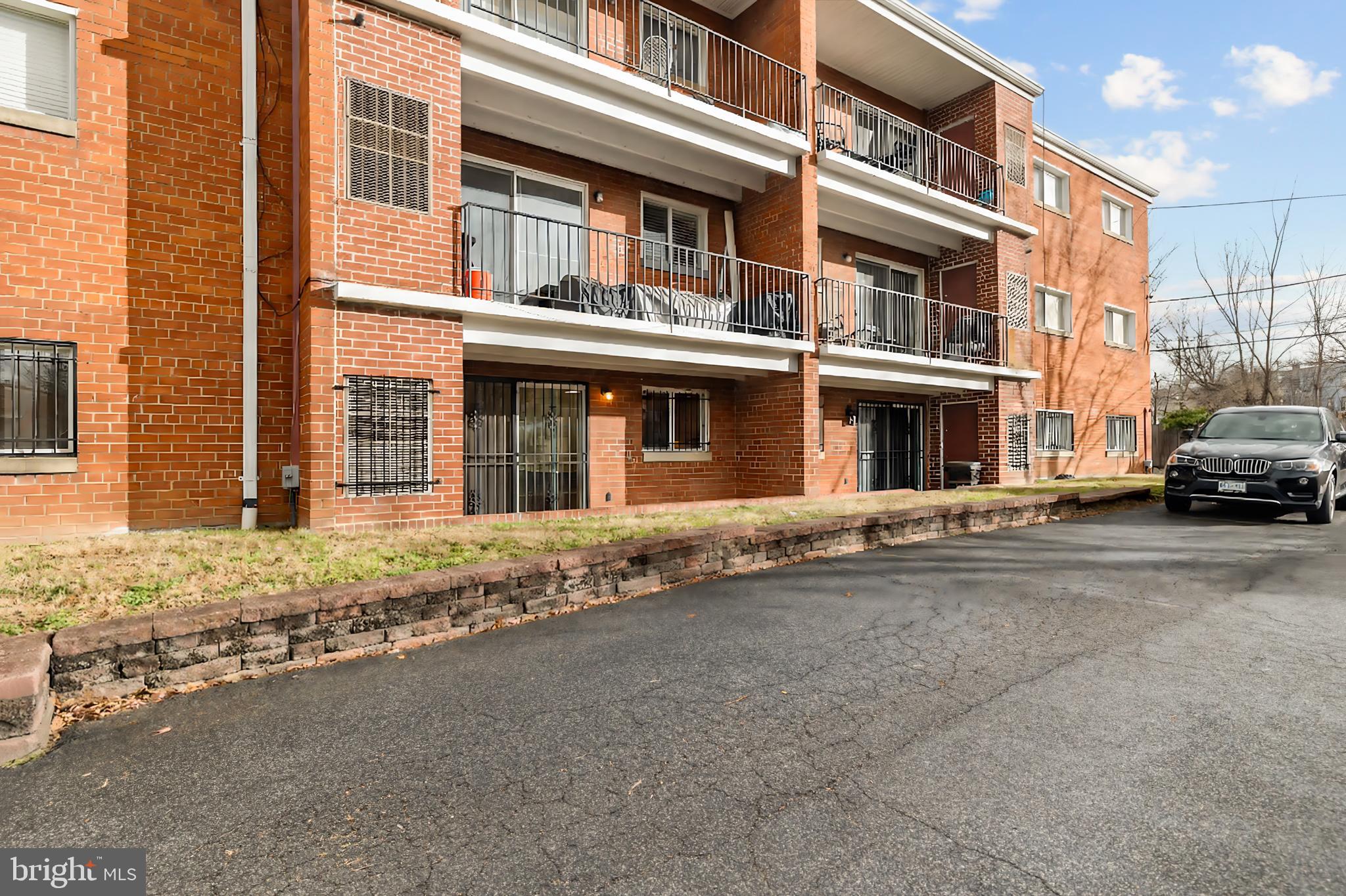 1386 Bryant Street Northeast, Unit 103 Washington, DC 20018 - Photo 25 of 28 a building with street view