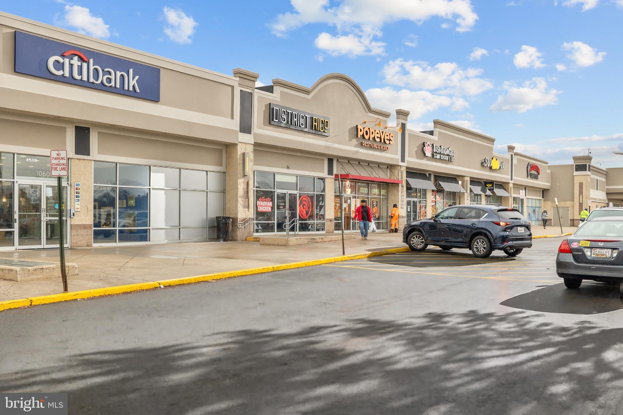 1386 Bryant Street Northeast, Unit 103 Washington, DC 20018 - Photo 27 of 28 a view of a building with car parked