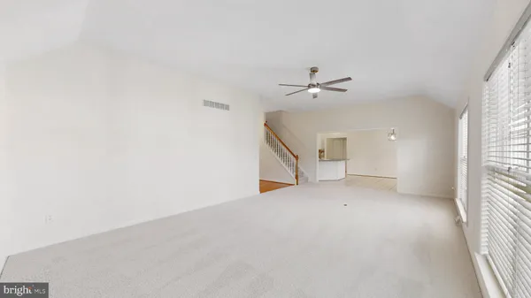 a kitchen with kitchen island a sink appliances and cabinets