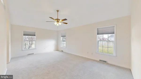 a white bath tub sitting next to a window