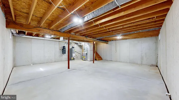 a view of a house with a big yard and a large tree