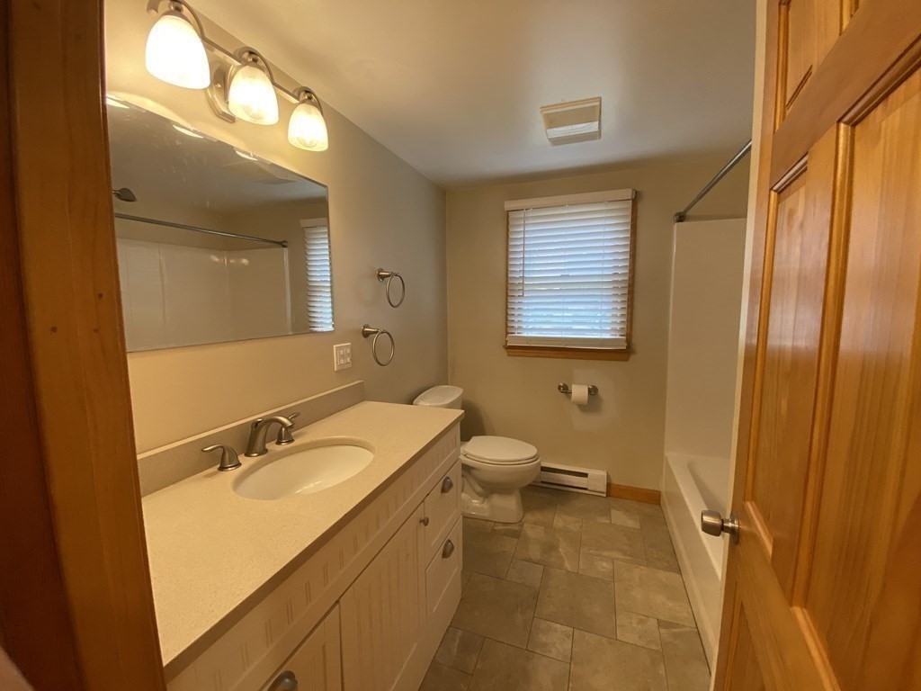 66 Scituate Road Mashpee, MA 02649 - Photo 14 of 33 a bathroom with a sink and a mirror