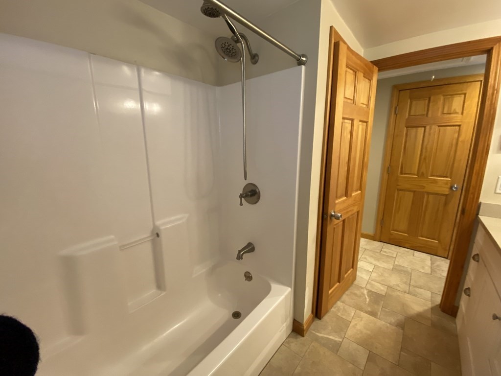 66 Scituate Road Mashpee, MA 02649 - Photo 16 of 33 a bathroom with a bathtub and a shower