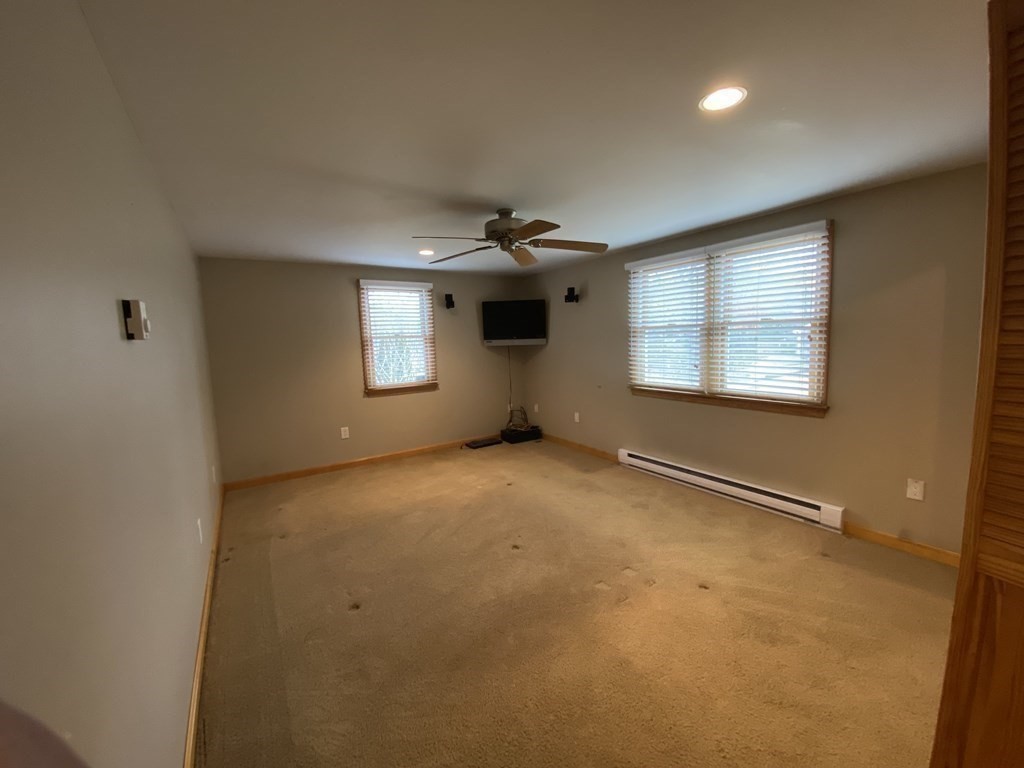 66 Scituate Road Mashpee, MA 02649 - Photo 18 of 33 an empty room with a empty space and windows