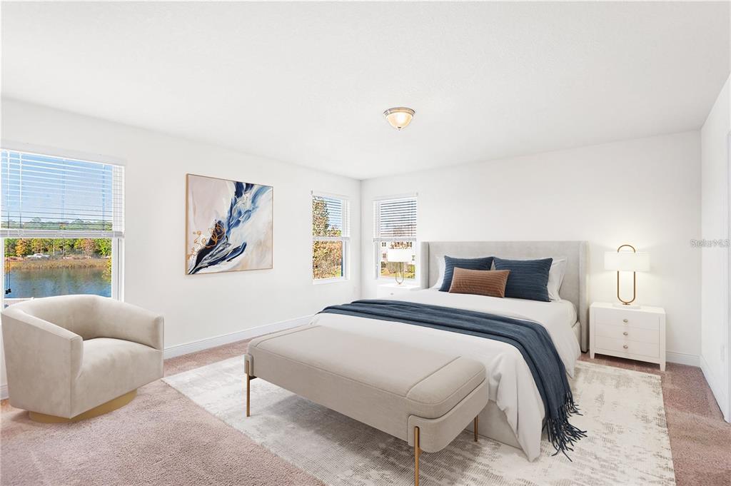 1848 Oak Hammock Court Lutz, FL 33558 - Photo 11 of 25 a bedroom with a bed and a couch