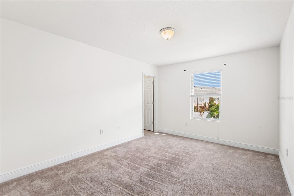 1848 Oak Hammock Court Lutz, FL 33558 - Photo 17 of 25 an empty room with windows
