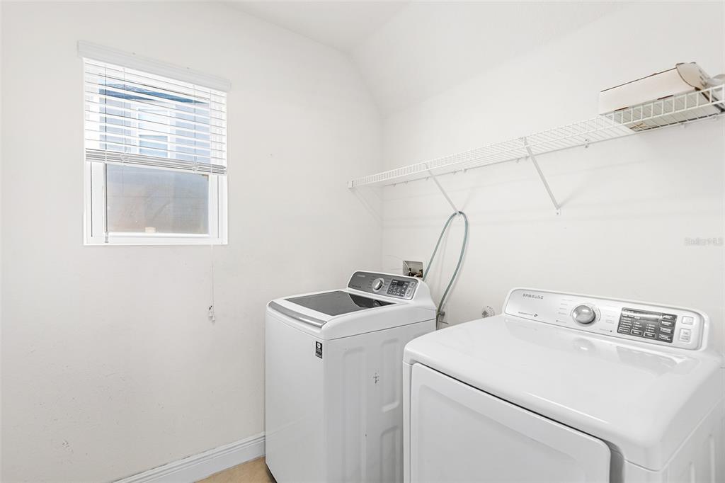 1848 Oak Hammock Court Lutz, FL 33558 - Photo 20 of 25 a utility room with dryer and washer