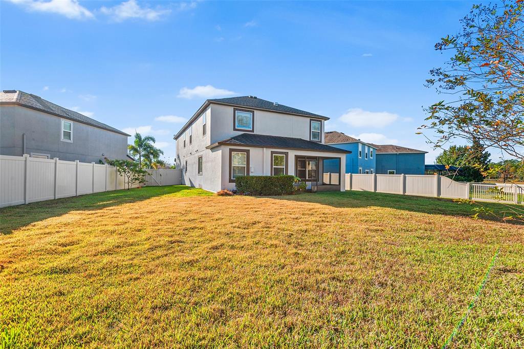 1848 Oak Hammock Court Lutz, FL 33558 - Photo 22 of 25 a house with a yard