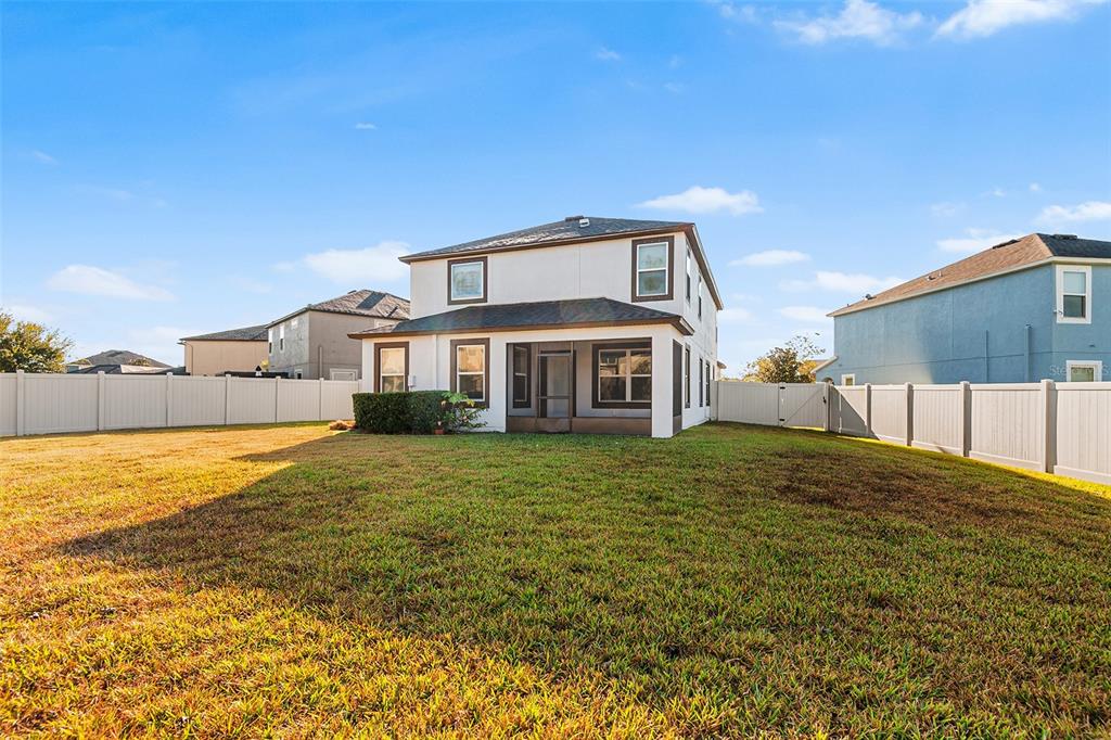1848 Oak Hammock Court Lutz, FL 33558 - Photo 23 of 25 a front view of a house with a yard