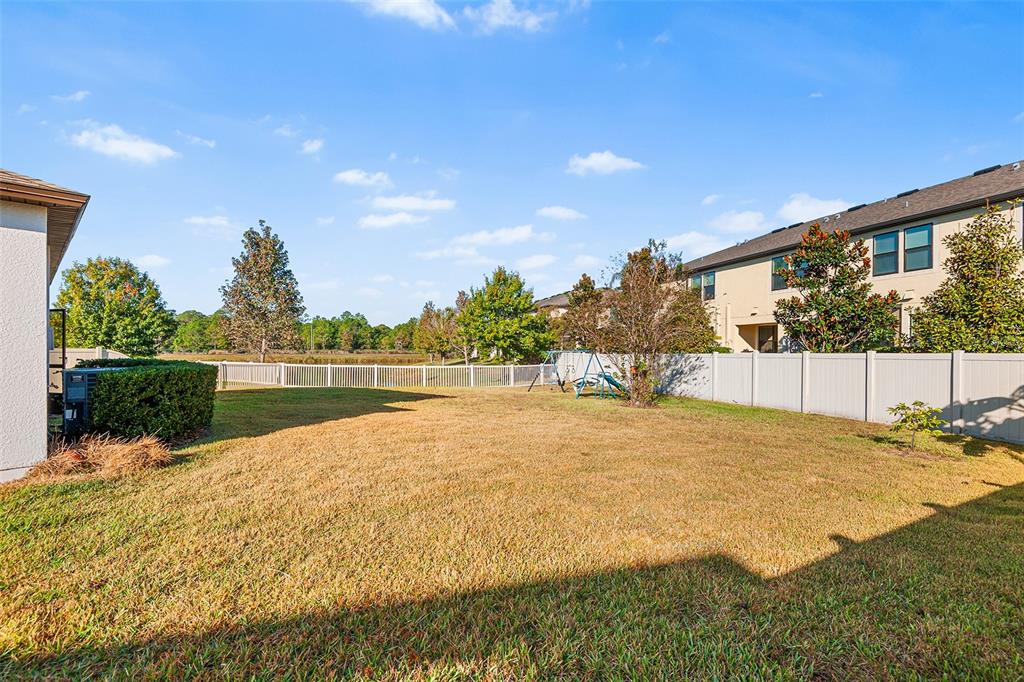 1848 Oak Hammock Court Lutz, FL 33558 - Photo 24 of 25 a view of a lake with a house